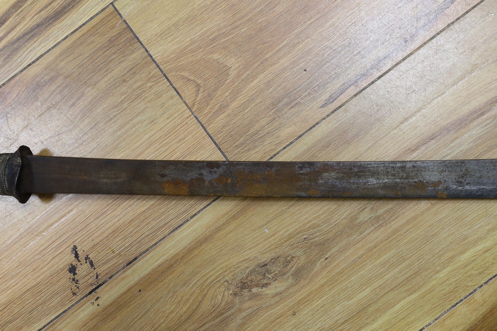 Two Burmese dha swords.